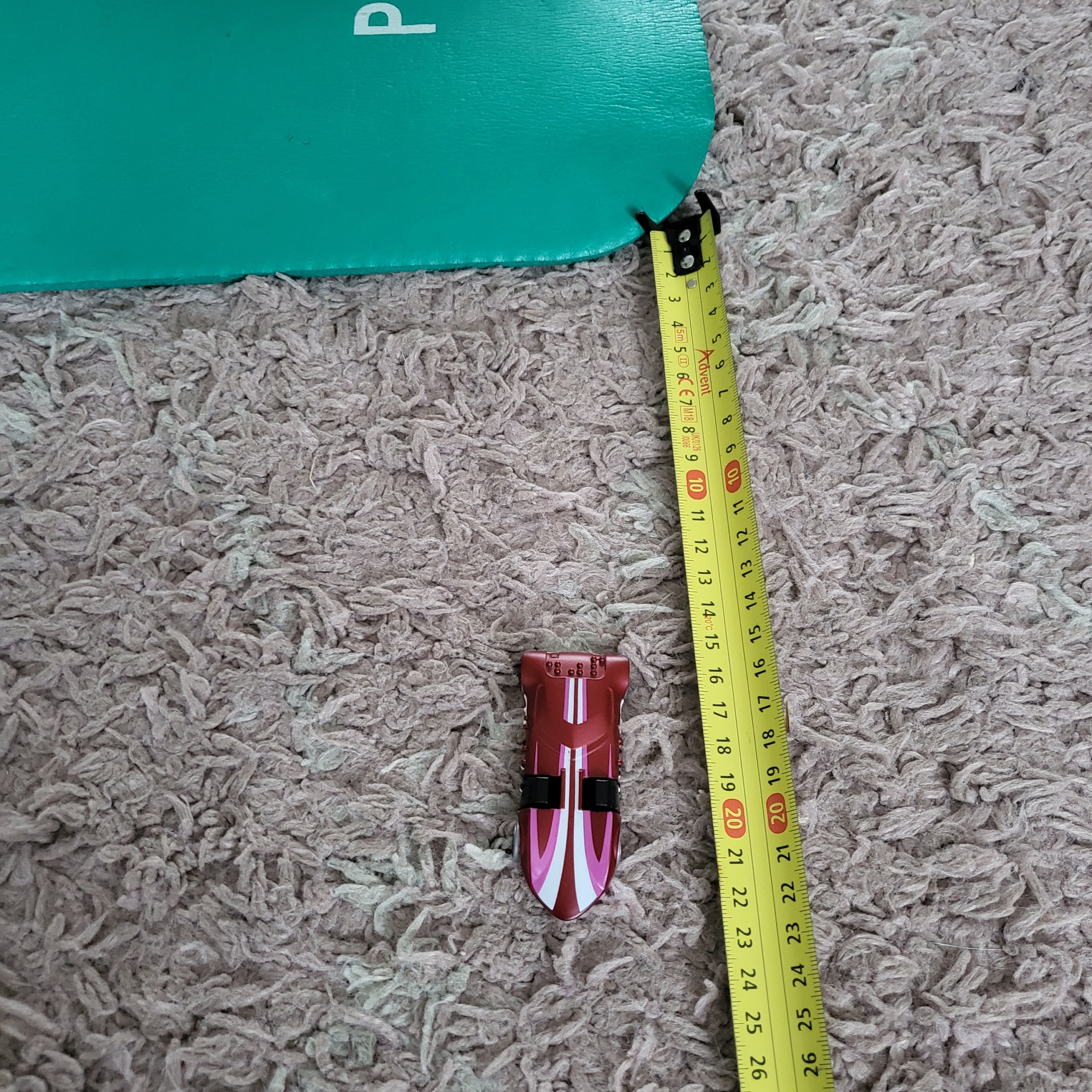 Measuring how far the car travelled on carpet